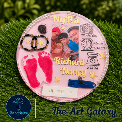 Baby birth memory preservation frame with hospital band, footprint and first clothes in resin