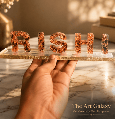 Preserved rose petals set into an alphabet resin nameplate Preserved rose petals set into an alphabet resin nameplate